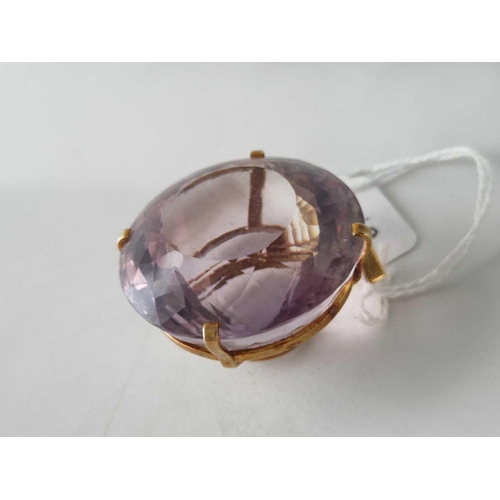 19 - A VERY LARGE GOLD MOUNTED FACETED AMETHYST PENDANT