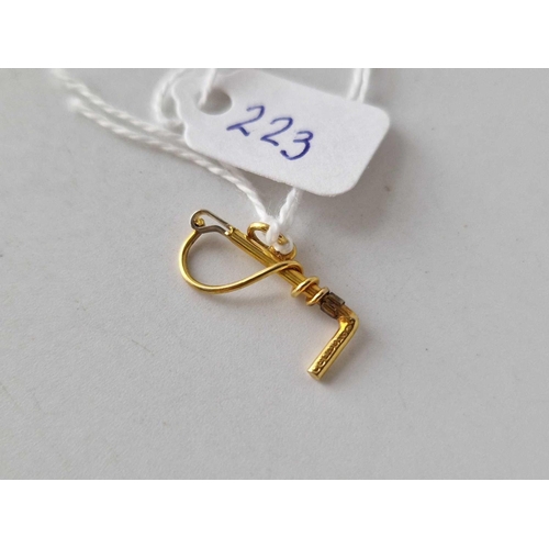 223 - A riding crop charm 9ct