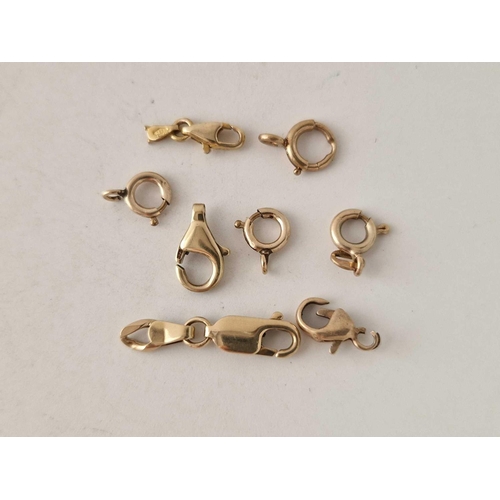 247 - 8 x 9ct gold clasps the largest 12mm in size 4.3g