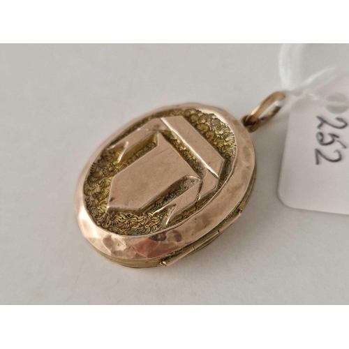 252 - A Victorian novelty gold back and front locket with clasped hands and yours forever