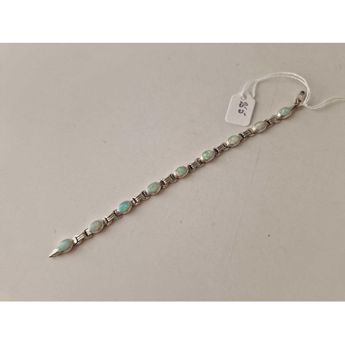 255 - A WHITE GOLD OPAL BRACELET 14CT GOLD 7 INCH 14.6 GMS