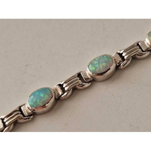 255 - A WHITE GOLD OPAL BRACELET 14CT GOLD 7 INCH 14.6 GMS