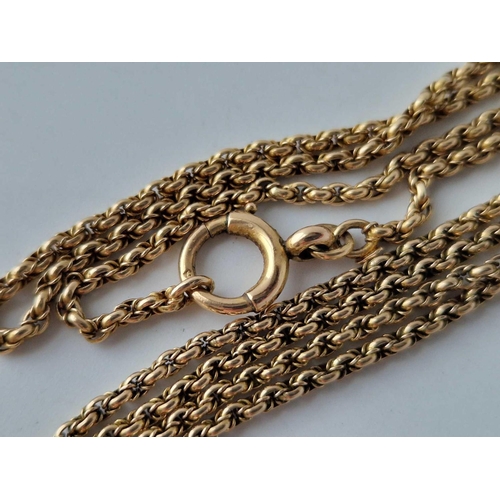 26 - A ANTIQUE GUARD CHAIN 15CT GOLD WITH 9CT CLASP 25.9 GMS INC.