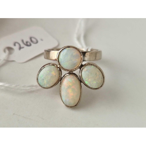 260 - A WHITE GOLD AND OPAL FOUR STONE RING 18CT GOLD TESTED SIZE O 7.7 GMS BOXED