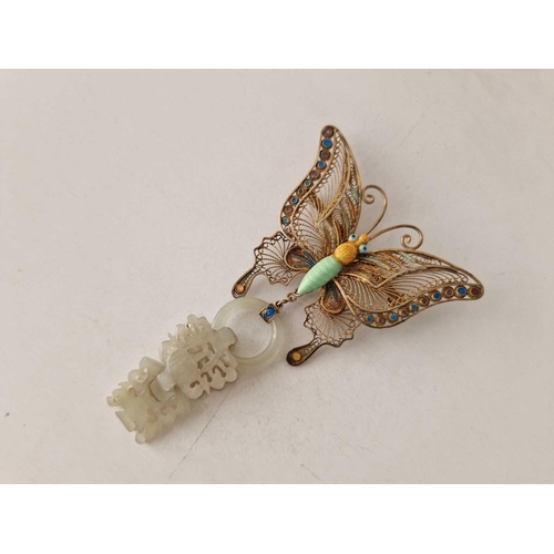 264 - A UNUSUAL GILT BUTTERFLY BROOCH WITH CARVED JADE PENDANT