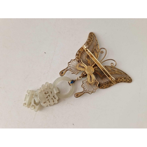 264 - A UNUSUAL GILT BUTTERFLY BROOCH WITH CARVED JADE PENDANT