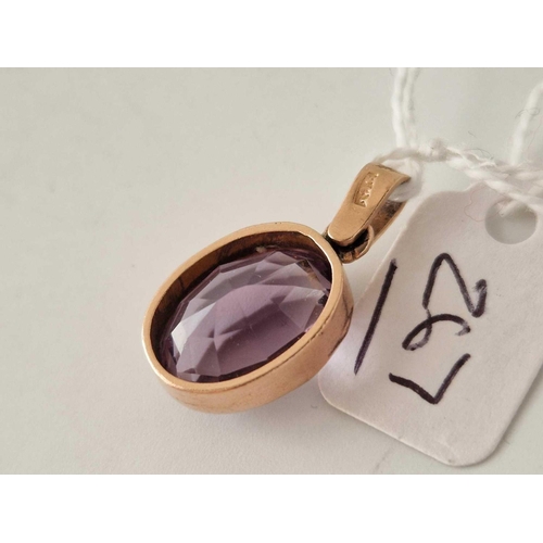 267 - A purple gem stone pendant