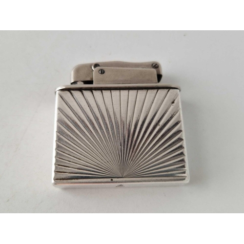 331 - A silver mounted lighter with star burst design