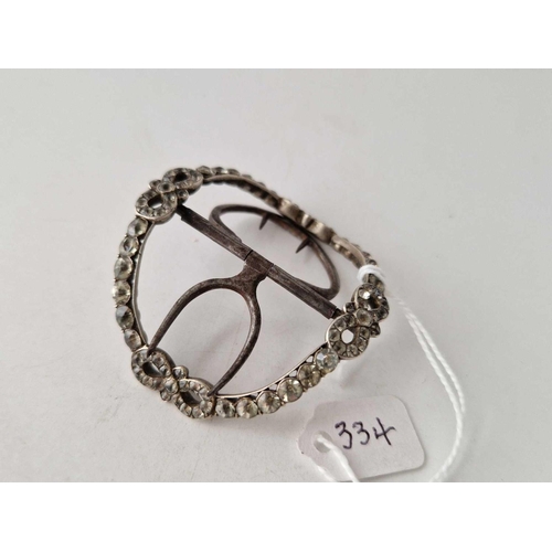 334 - A Georgian shoe buckle in silver set with black paste with bow design