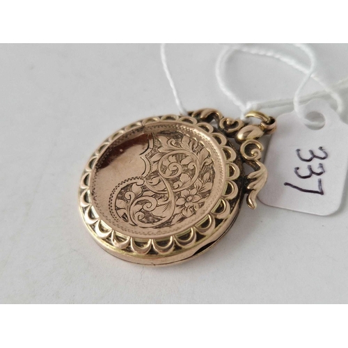 337 - A Victorian back and front circular locket with chased decoration 30mm diam