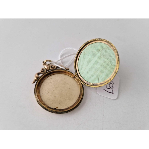 337 - A Victorian back and front circular locket with chased decoration 30mm diam