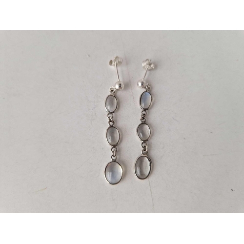 339 - A pair of moonstone drop earrings mounted in silver with silver ear stud fittings