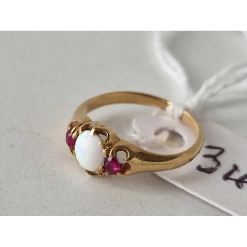 340 - A antique Edwardian opal and ruby three stone childs ring in high carat gold size D 1.6 gms