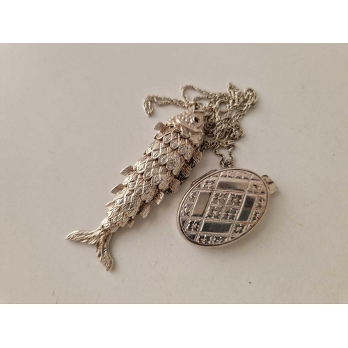 344 - A large silver fish pendant on chain and silver locket, 35 g