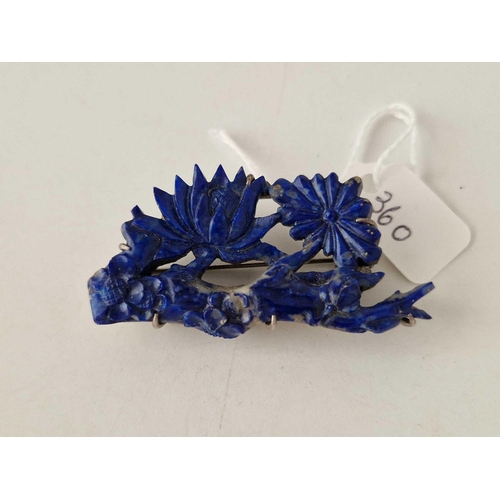 360 - A Chinese flower carved lapis and silver brooch