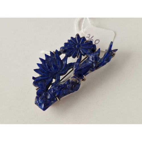 360 - A Chinese flower carved lapis and silver brooch