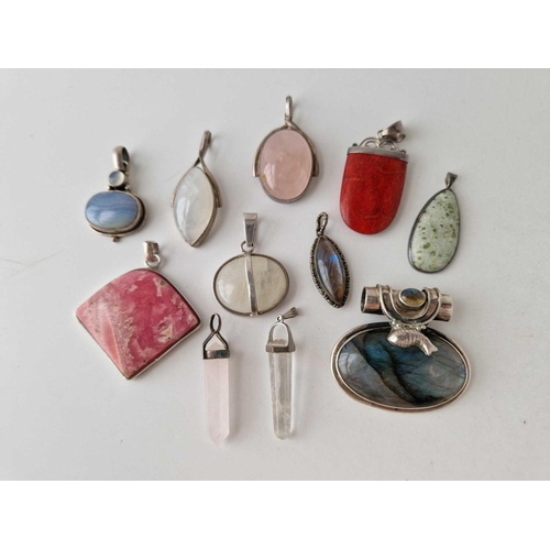 366 - Eleven silver stone set pendants