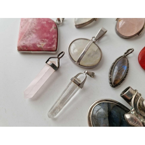 366 - Eleven silver stone set pendants