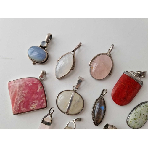 366 - Eleven silver stone set pendants