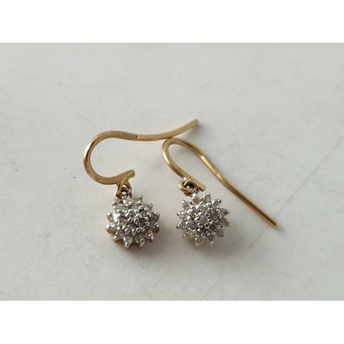 370 - A pair of diamond cluster drop earrings