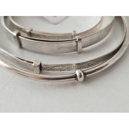 403 - Four silver bangles 18 gms