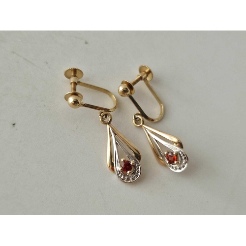 404 - A pair of diamond and garnet drop earrings with screw backs 9ct 1.5 gms