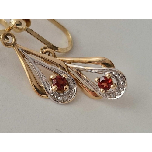 404 - A pair of diamond and garnet drop earrings with screw backs 9ct 1.5 gms