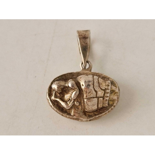 414 - An interesting silver pendant, possibly medieval of recumbant lady