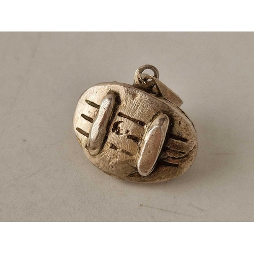 414 - An interesting silver pendant, possibly medieval of recumbant lady