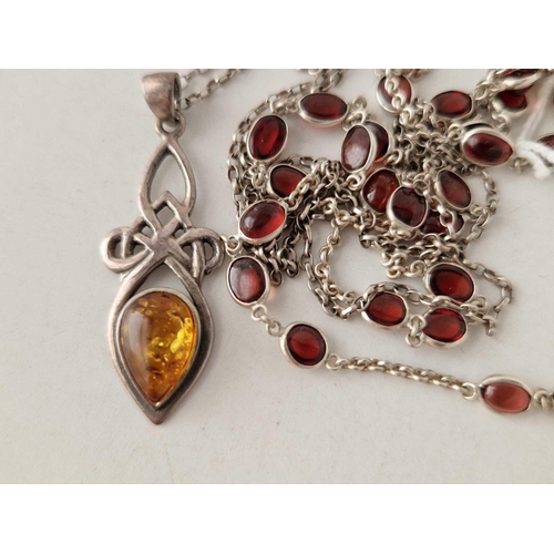 417 - An amber  silver pendant necklace together with an amber silver bead necklace