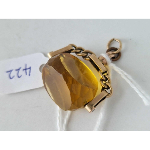 422 - A swivel fob with yellow stone 9ct