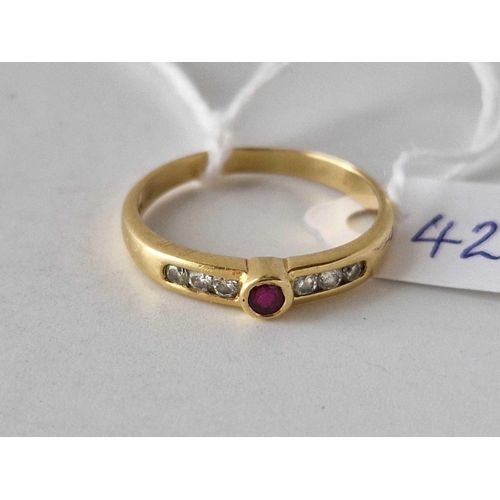 424 - A ruby and diamond ring 18c gold size P 2.7 gms