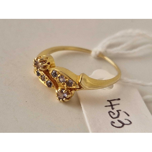 453 - A blue stone fancy cross over ring 18ct gold size M 2.4 gms