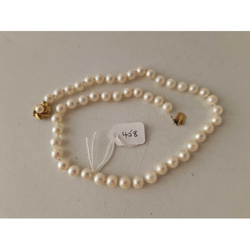 458 - A pearl necklace with high carat clasp 16 inch 28.2 gms