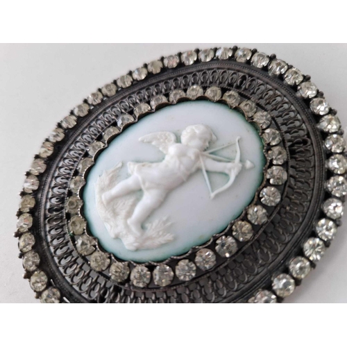 532 - A very large Victorian oval belt front set with paste and a central cameo of cupid with two hangers ... 