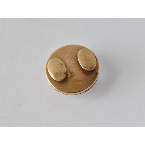 539 - A Victorian bachelor buttons set with a cabochon rock crystal the top setting pulls off to reveal a ... 