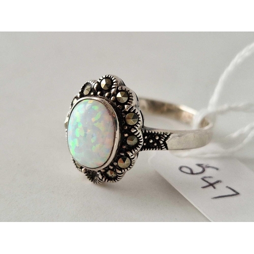 547 - A silver and marcasite and opal ring, size Y