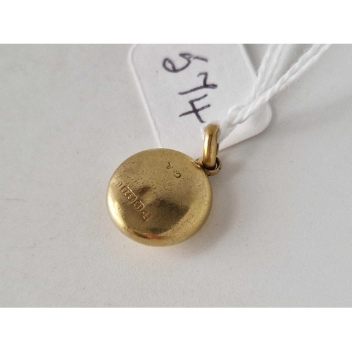 574 - A Victorian circular pendant 15ct gold 1.3 gms