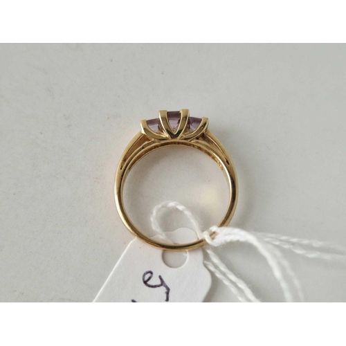 579 - A three stone amethyst ring 9ct size O 2.7 gms