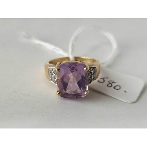 580 - A amethyst ring with diamond shoulders 9ct size N 5 gms