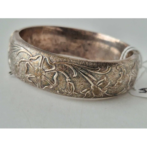 581 - A art nouveau style  hinged silver bangle 47 gms