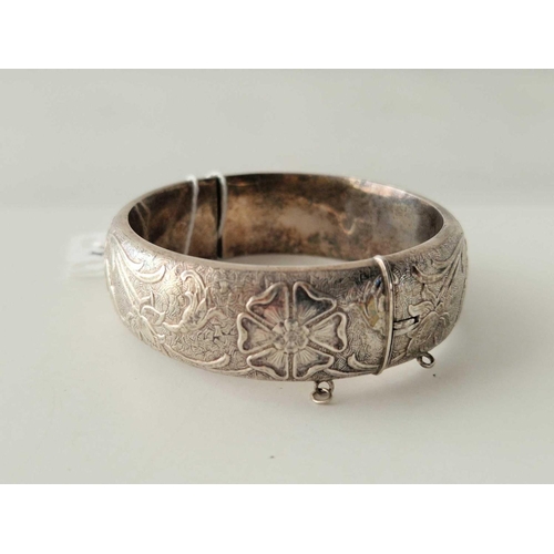 581 - A art nouveau style  hinged silver bangle 47 gms