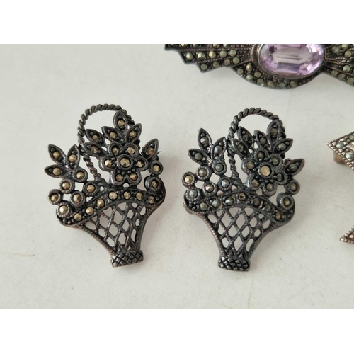 587 - Four silver and marcasite brooches 20 gms