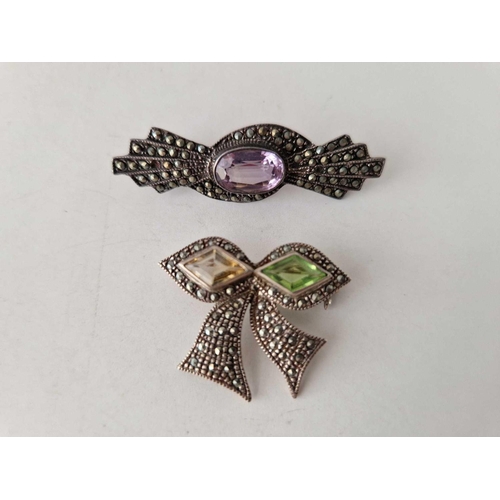 587 - Four silver and marcasite brooches 20 gms