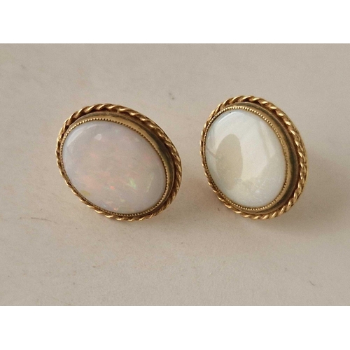 592 - A pair of oval opal earrings 9ct 2.7 gms