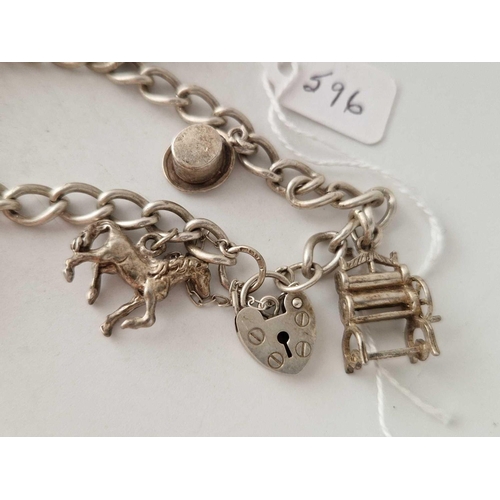 596 - A silver charm bracelet 7 inch 30 gms