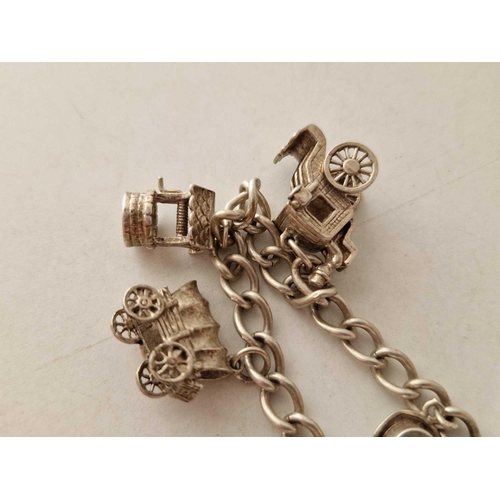 596 - A silver charm bracelet 7 inch 30 gms