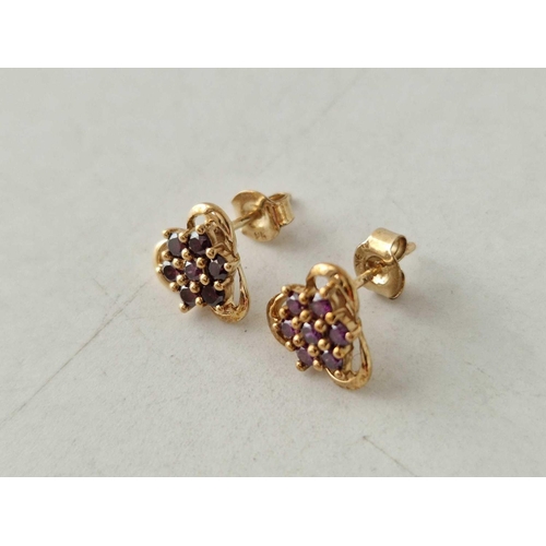 603 - A pair of purple diamond ear studs with COA 9ct 1.9 gms