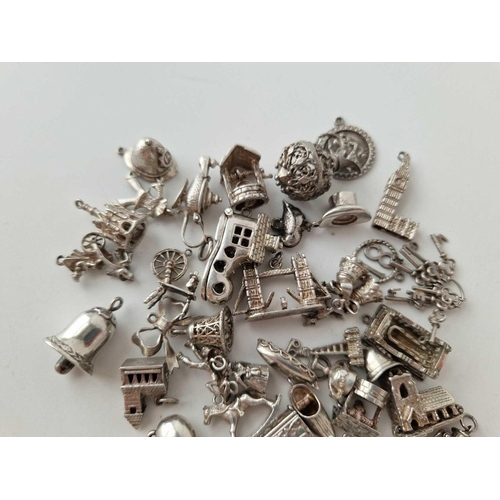 613 - A quantity of silver charms, 133 g