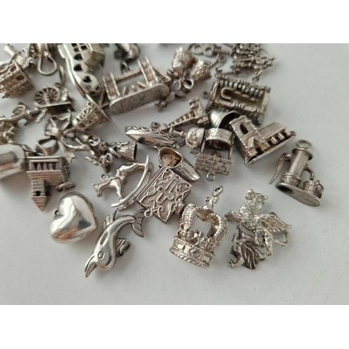 613 - A quantity of silver charms, 133 g